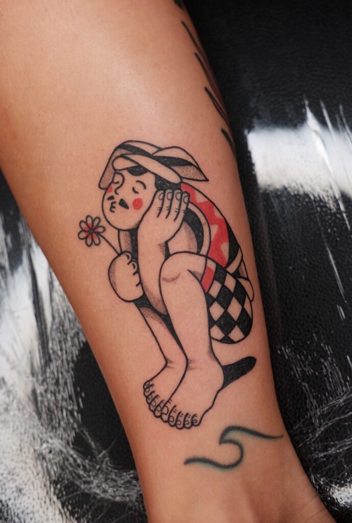 Man with flower tattoo - American Traditional Tattoo - August TRD